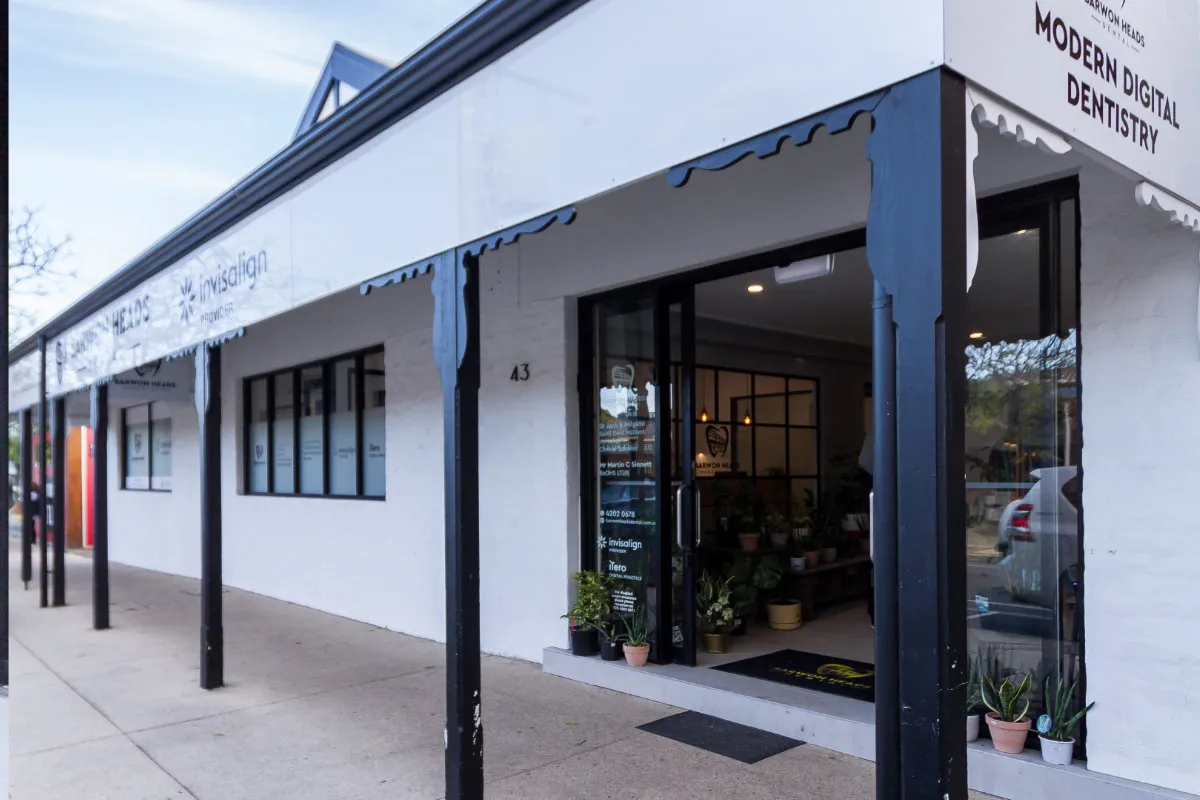 Side elevation of the dental clinic shopfront with a 'Modern Digital Dentistry' sign.