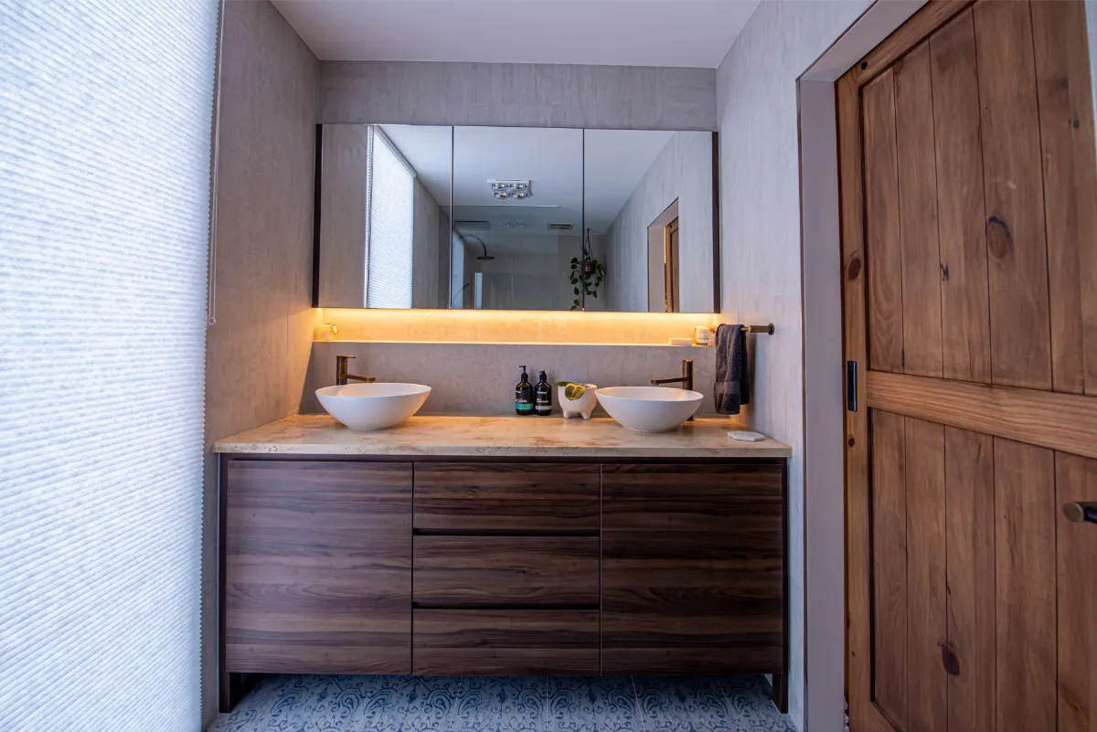 North Warrandyte ensuite with floating timber vanity and twin stone vessel basins.