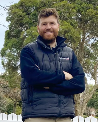 Founding director Tim Burmeister, wearing a Burmpro puffer jacket outdoors.